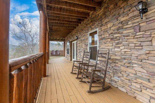 Rocking chairs on the lower deck at Smoky Mountain Escape, a 3 bedroom cabin rental located in Pigeon Forge