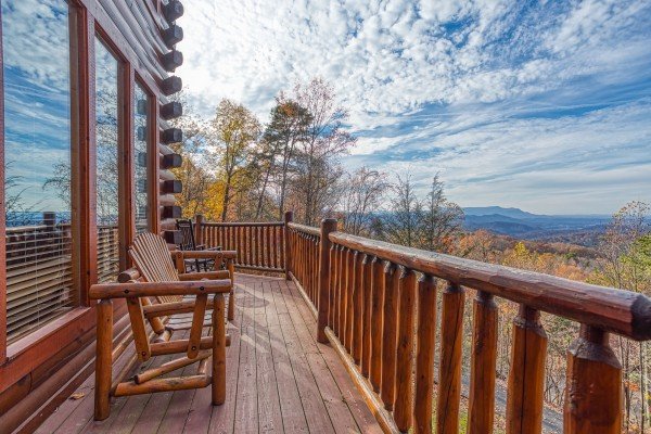 Deck with seating and mountain views at The Original American Dream, a 2 bedroom cabin rental located in Gatlinburg
