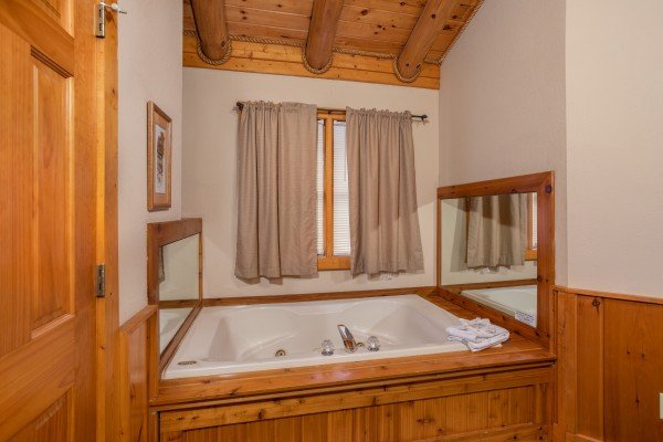 Jacuzzi in a bedroom at Starry Starry Night #725, a 2 bedroom cabin rental located in Pigeon Forge