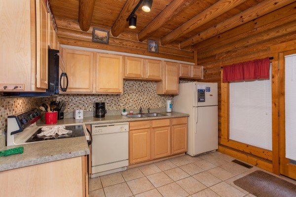 Kitchen with white appliances at Starry Starry Night #725, a 2 bedroom cabin rental located in Pigeon Forge