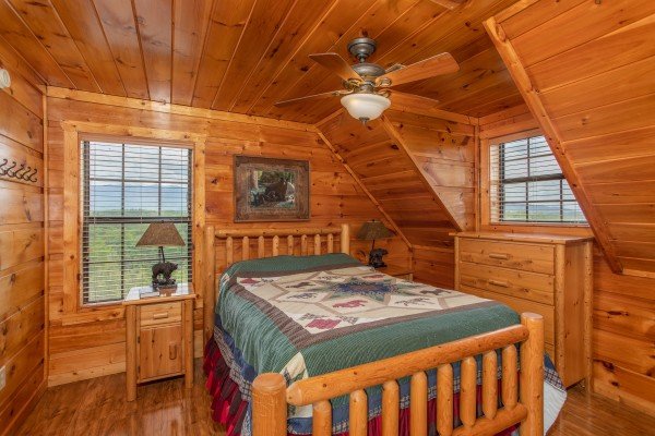 Bedroom with a log bed and dresser at Mountain Bliss, a 2 bedroom cabin rental located in Pigeon Forge
