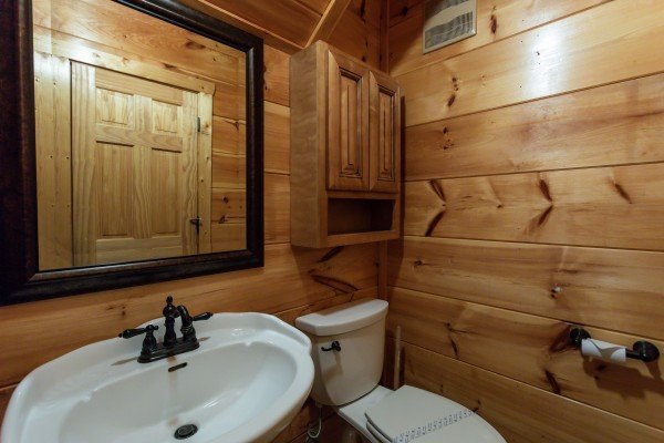 Half bath at Mountain Bliss, a 2 bedroom cabin rental located in Pigeon Forge