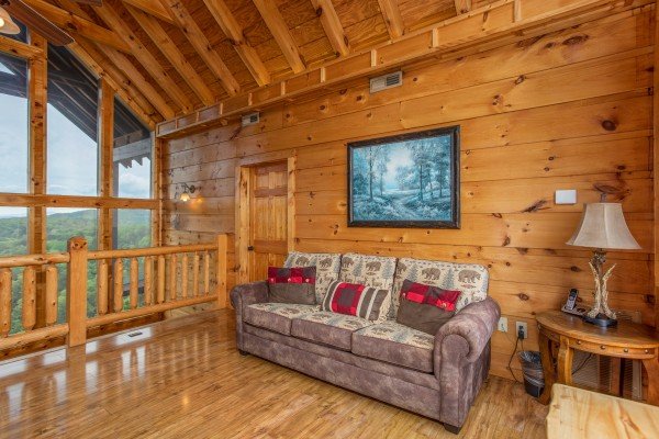 Sofa in the loft area at Mountain Bliss, a 2 bedroom cabin rental located in Pigeon Forge