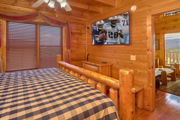 Main floor bedroom TV at Million Dollar View, a 2 bedroom cabin rental located in Pigeon Forge