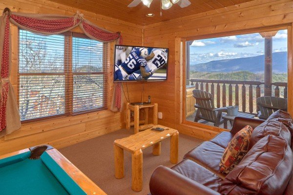 TV in game room  at Million Dollar View, a 2 bedroom cabin rental located in Pigeon Forge