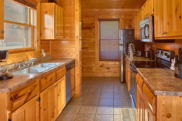 Kitchen with stainless steel appliances at Million Dollar View, a 2 bedroom cabin rental located in Pigeon Forge