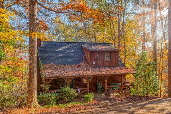 Fall colors on the cabin exterior at Whispering Pines, a 2 bedroom cabin rental located in Pigeon Forge