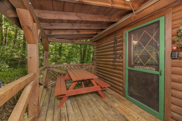 Picnic table at Whispering Pines, a 2 bedroom cabin rental located in Pigeon Forge