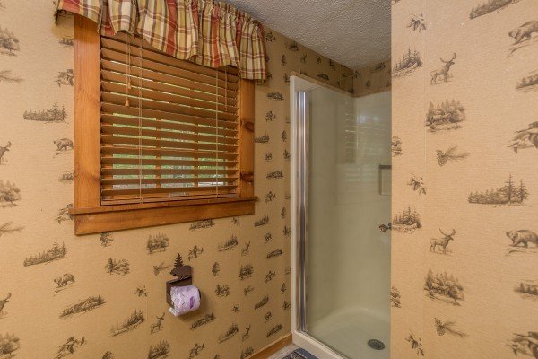 En suite bathroom with shower stall at Whispering Pines, a 2 bedroom cabin rental located in Pigeon Forge