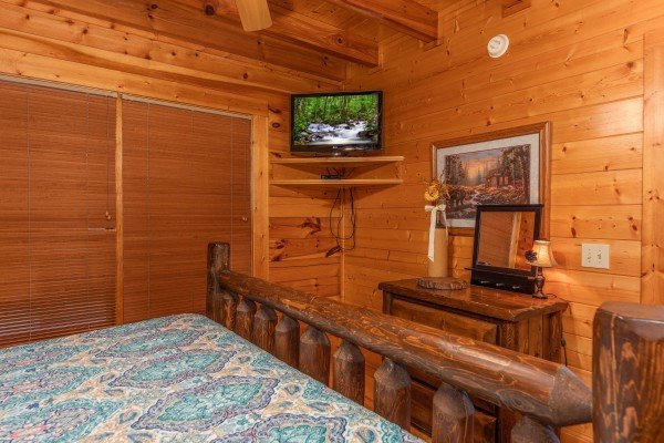TV and dresser in a bedroom at Rocky Top Retreat, a 2 bedroom cabin rental located in Pigeon Forge