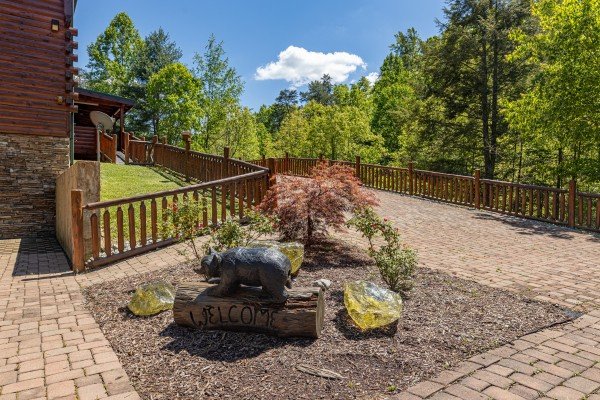 Landscaping in the driveway at Smokies Paradise Lodge, a 5 bedroom cabin rental located in Pigeon Forge