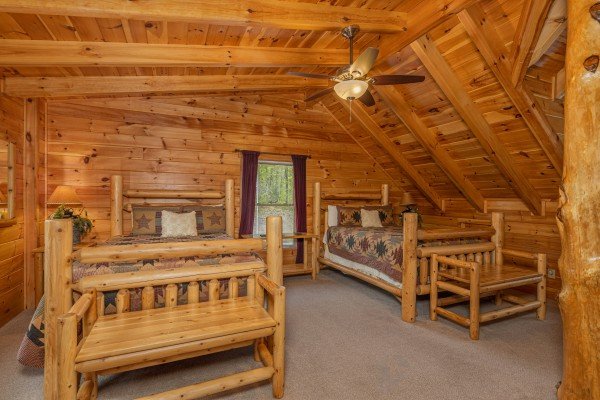 Beds in the loft at Smokies Paradise Lodge, a 5 bedroom cabin rental located in Pigeon Forge
