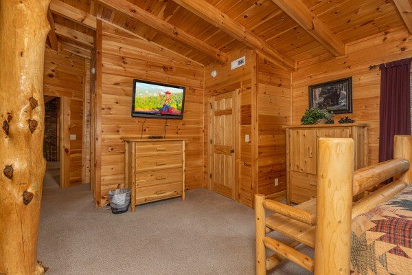 TV and dresser in the loft at Smokies Paradise Lodge, a 5 bedroom cabin rental located in Pigeon Forge
