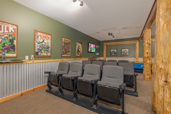 Seating in the movie room at Smokies Paradise Lodge, a 5 bedroom cabin rental located in Pigeon Forge