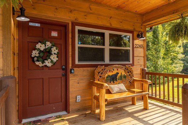 Porch bench at 2 Crazy Cubs, a 2 bedroom cabin rental located in Pigeon Forge