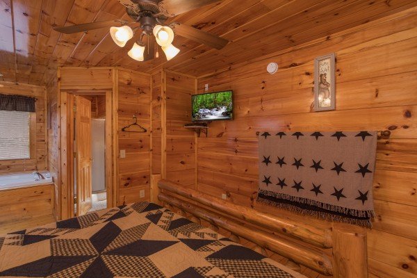 TV in a bedroom at Just Relax, a 2 bedroom cabin rental located in Pigeon Forge