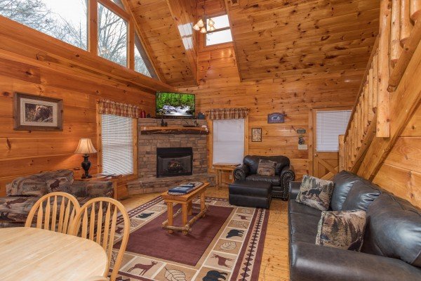 Living room with fireplace and TV at Just Relax, a 2 bedroom cabin rental located in Pigeon Forge