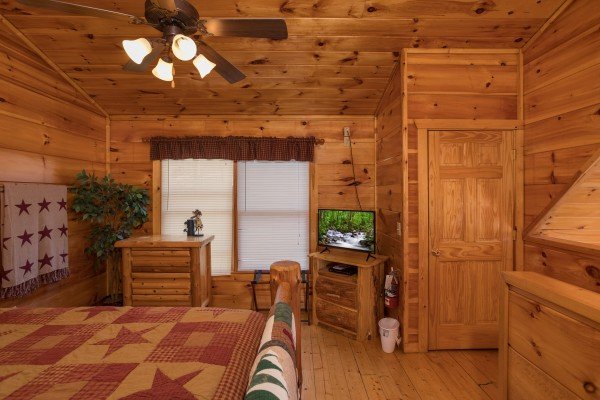 Dresser and TV in a bedroom at Just Relax, a 2 bedroom cabin rental located in Pigeon Forge