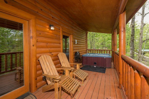 Lounge chairs on a covered deck at Tennessee Treasure, a 3 bedroom cabin rental located in Pigeon Forge