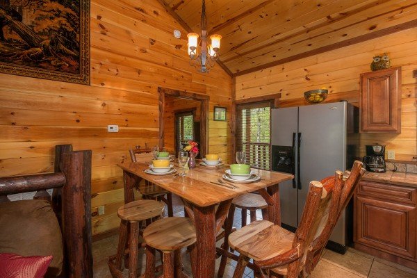 Dining room table for six at Tennessee Treasure, a 3 bedroom cabin rental located in Pigeon Forge