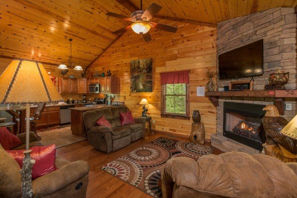 Great main room with living room and kitchen at Tennessee Treasure, a 3 bedroom cabin rental located in Pigeon Forge