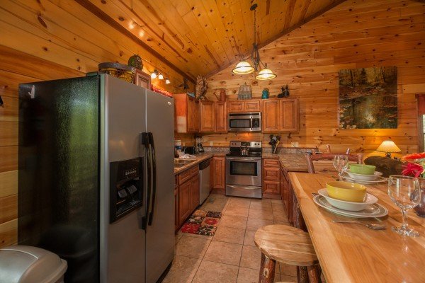 Kitchen with stainless appliances at Tennessee Treasure, a 3 bedroom cabin rental located in Pigeon Forge