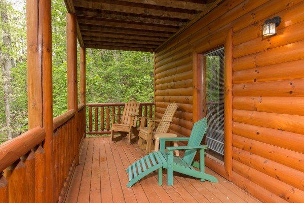 Deck with chairs at Tennessee Treasure, a 3 bedroom cabin rental located in Pigeon Forge