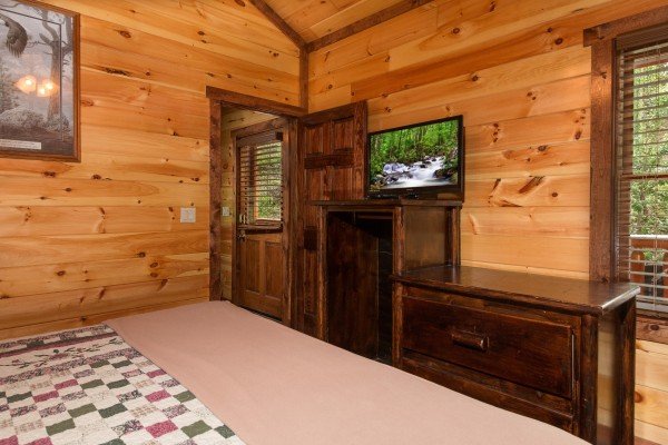 Dresser and TV in a bedroom at Tennessee Treasure, a 3 bedroom cabin rental located in Pigeon Forge