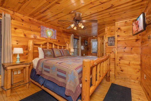 Bedroom with log bed, night stands, and lamps at Dragonfly, a 2 bedroom cabin rental located in Gatlinburg