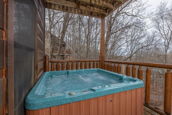Hot tub on the lower deck at Dragonfly, a 2 bedroom cabin rental located in Gatlinburg