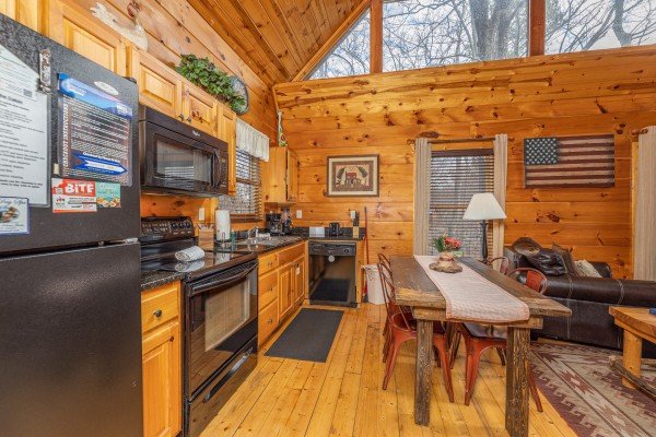 Kitchen with black appliances at Dragonfly, a 2 bedroom cabin rental located in Gatlinburg