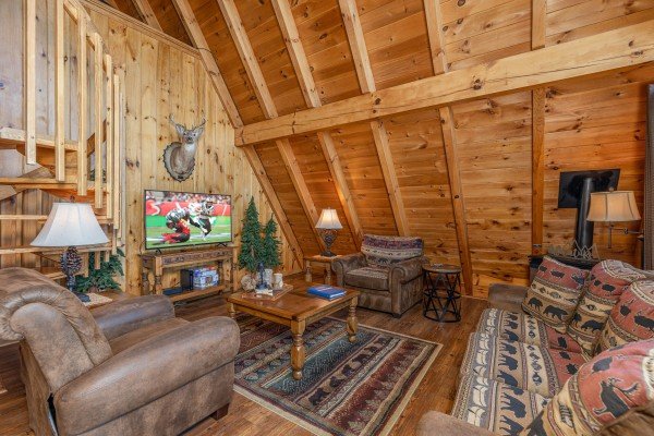 Living room with TV at Cozy Mountain View, a 1 bedroom cabin rental located in Pigeon Forge