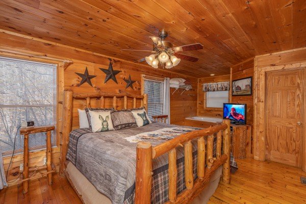 Bedroom with a log bed at Just You and Me Baby, a 1 bedroom cabin rental located in Gatlinburg