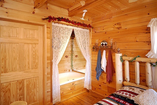 King bedroom with jacuzzi tub at Shy Bear, a 2 bedroom cabin rental located in Pigeon Forge