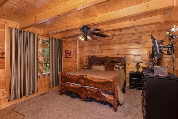 Second bedroom with a wooden bed at Bears Eye View, a 2-bedroom cabin rental located in Pigeon Forge