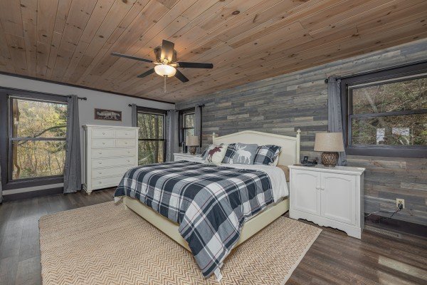 King bed, night stands, lamps, and dresser in a bedroom at Ober the Top Views, a 3 bedroom cabin rental located in Gatlinburg