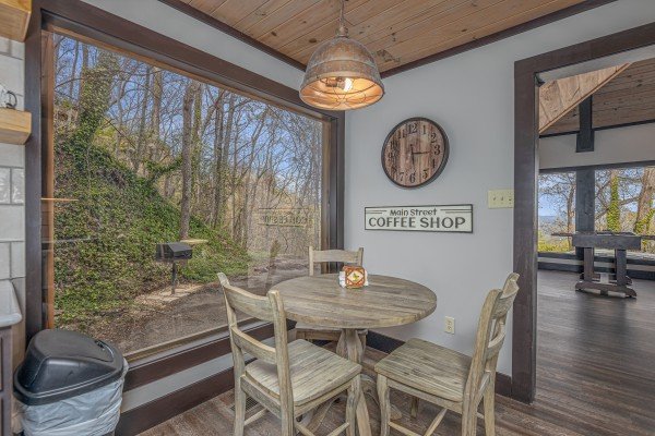 Dining table for three at Ober the Top Views, a 3 bedroom cabin rental located in Gatlinburg