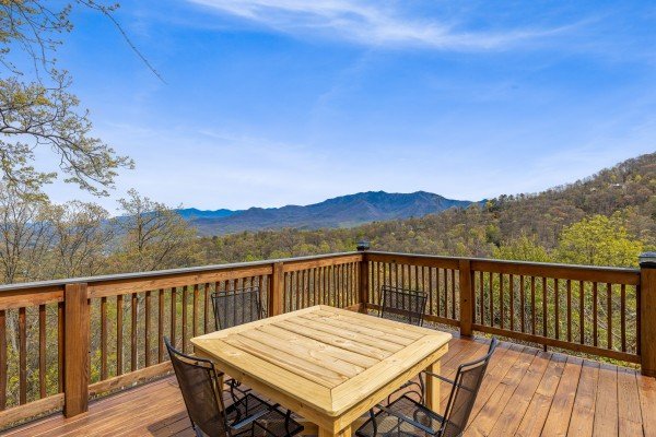 Outdoor dining on a patio at Ober the Top Views, a 3 bedroom cabin rental located in Gatlinburg