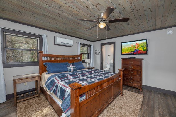 King bed, night stands, and a dresser in a bedroom at Ober the Top Views, a 3 bedroom cabin rental located in Gatlinburg