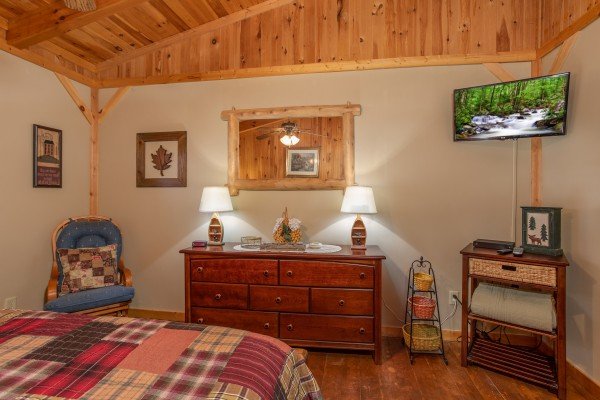 Dresser, console table, and TV in the loft bedroom at Bearfoot Adventure, a Gatlinburg Cabin rental