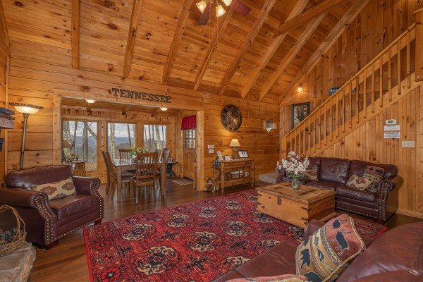 Living room and dining space at Bearfoot Adventure, a Gatlinburg Cabin rental