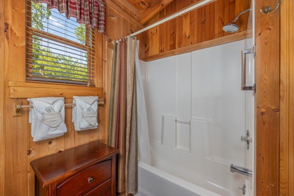 Bathroom with a tub and shower at Bearfoot Adventure, a 2 bedroom cabin rental located in Gatlinburg