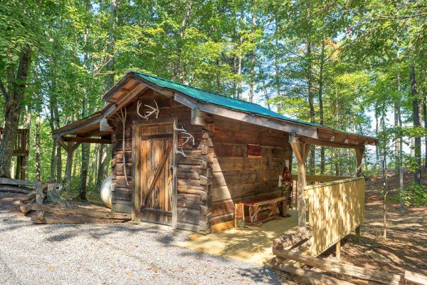 Tiny decorative cabin in the driveway at bearfoot adventure a 2 bedroom cabin rental located in gatlinburg