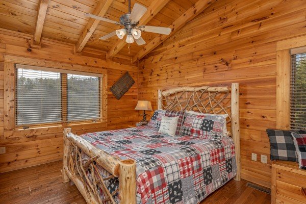 Bedroom with a wood bed at Mountain Mama, a 3 bedroom cabin rental located in Pigeon Forge