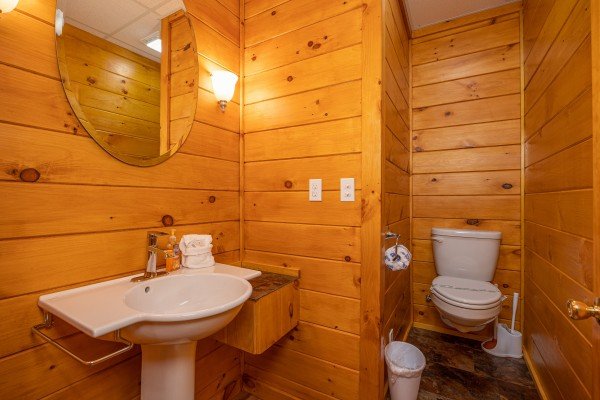 Half bath at Eagle's Sunrise, a 2 bedroom cabin rental located in Pigeon Forge
