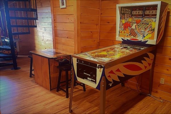 Arcade and pinball game at Eagle's Sunrise, a 2 bedroom cabin rental located in Pigeon Forge