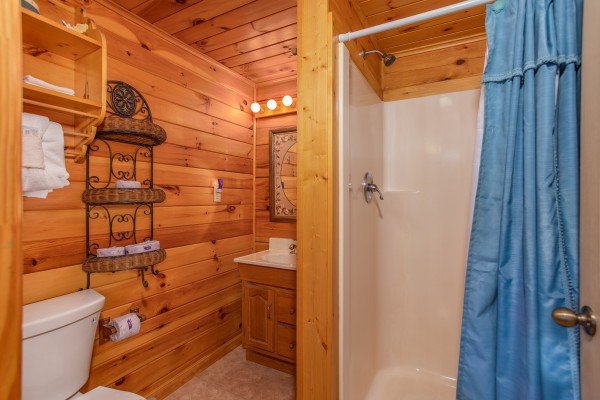 Bathroom with a walk in shower at Love Me Tender, a 1 bedroom cabin rental located in Pigeon Forge