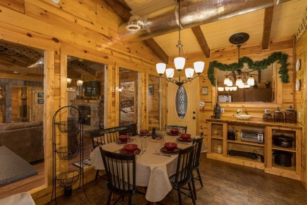 Dining room with seating for six at Rustic Ranch, a 2 bedroom cabin rental located in Pigeon Forge