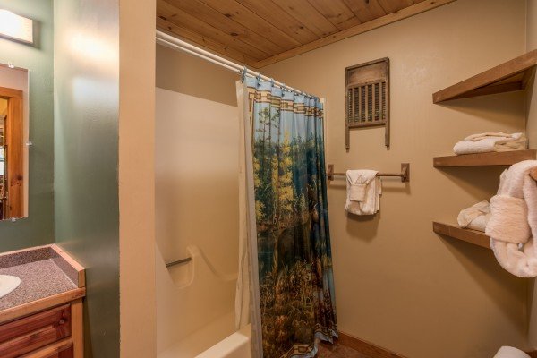 Bathroom with a tub and shower at Alone at the Top, a 3 bedroom cabin rental located in Pigeon Forge