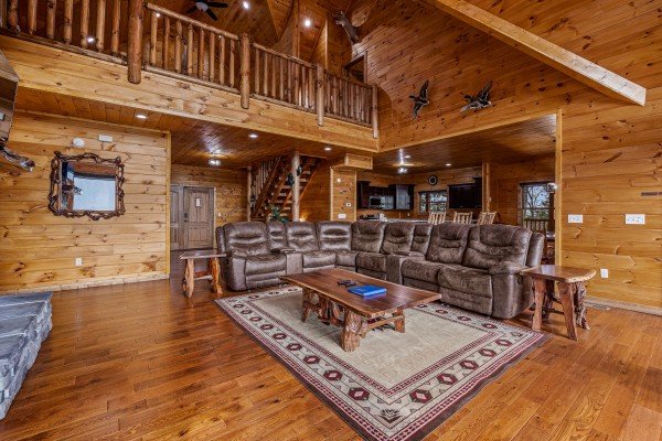 Living room seating at Four Seasons Grand, a 5 bedroom cabin rental located in Pigeon Forge